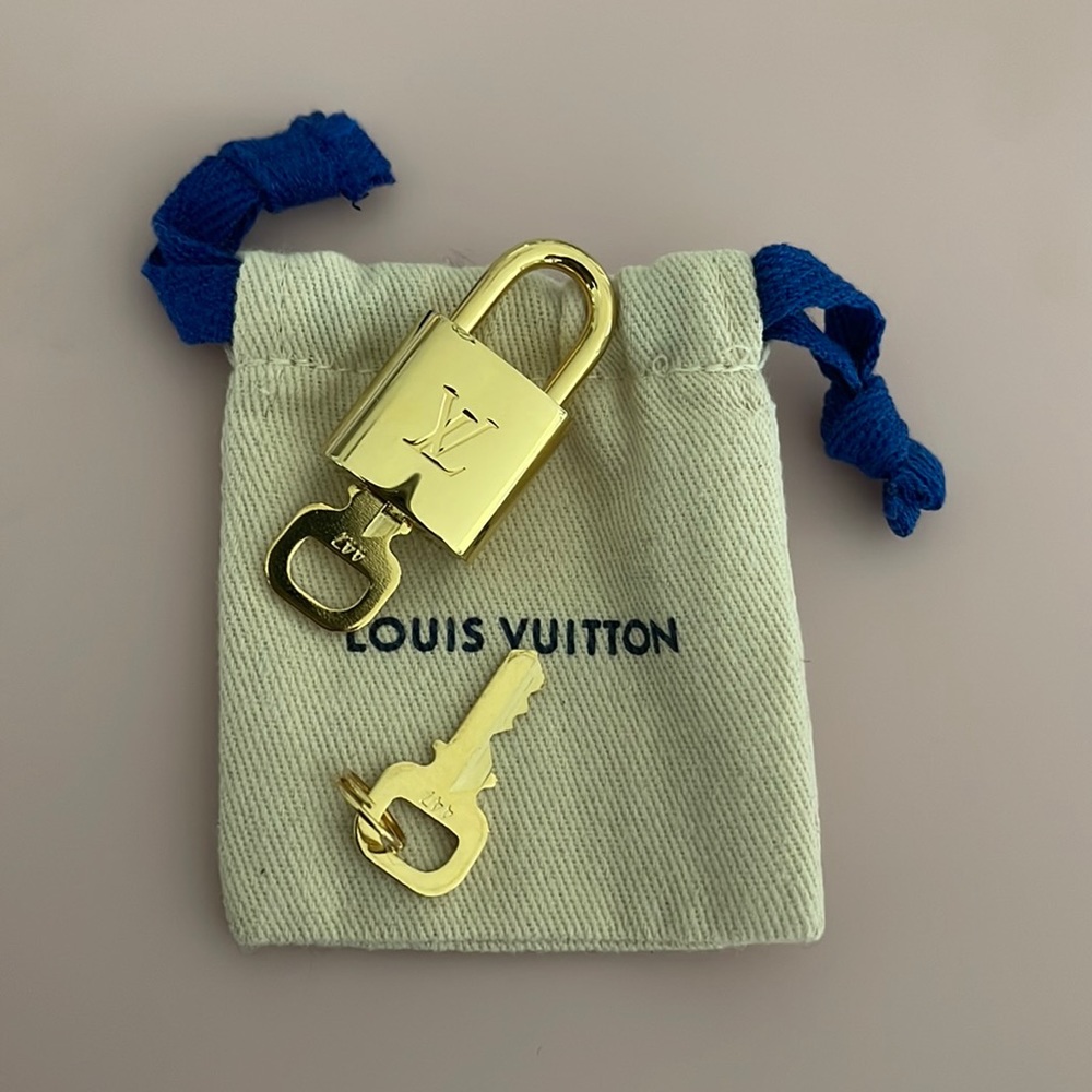Authentic Louis Vuitton lock and key with dust bag! Perfect condition!